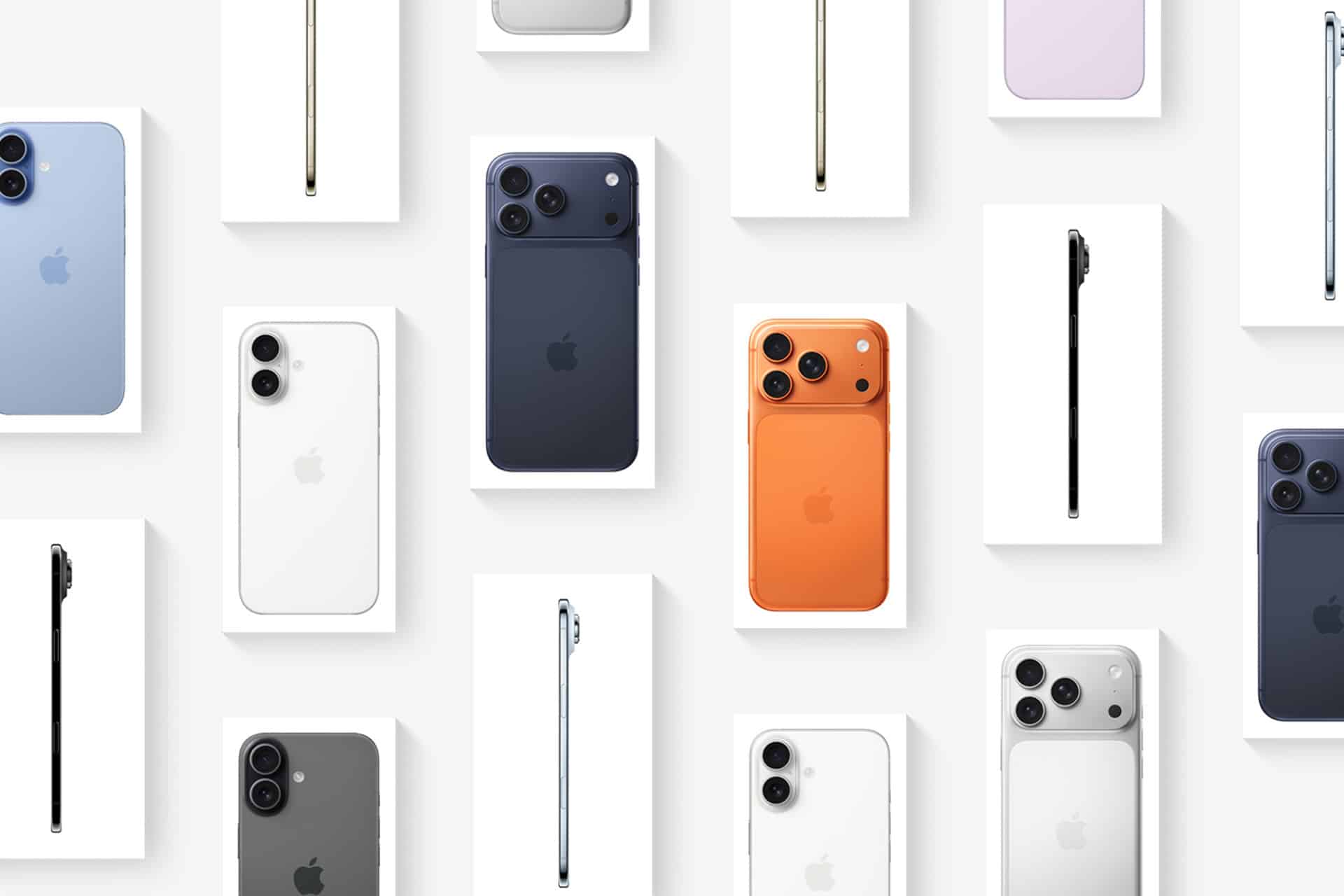 Multiple iPhones in various colors, including blue, black, white, orange, purple, and gray, are arranged neatly on white rectangular surfaces, showing both the back and side profiles of the devices—perfect for those considering options like Apple Upgrade or iPhone financing.